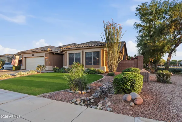 a front view of a house with garden