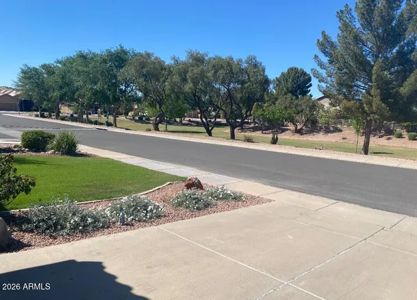 a view of room with window and wooden floor