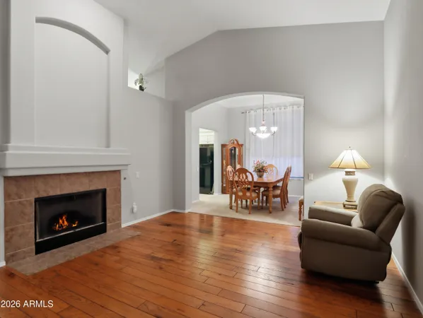 a living room with furniture and kitchen view