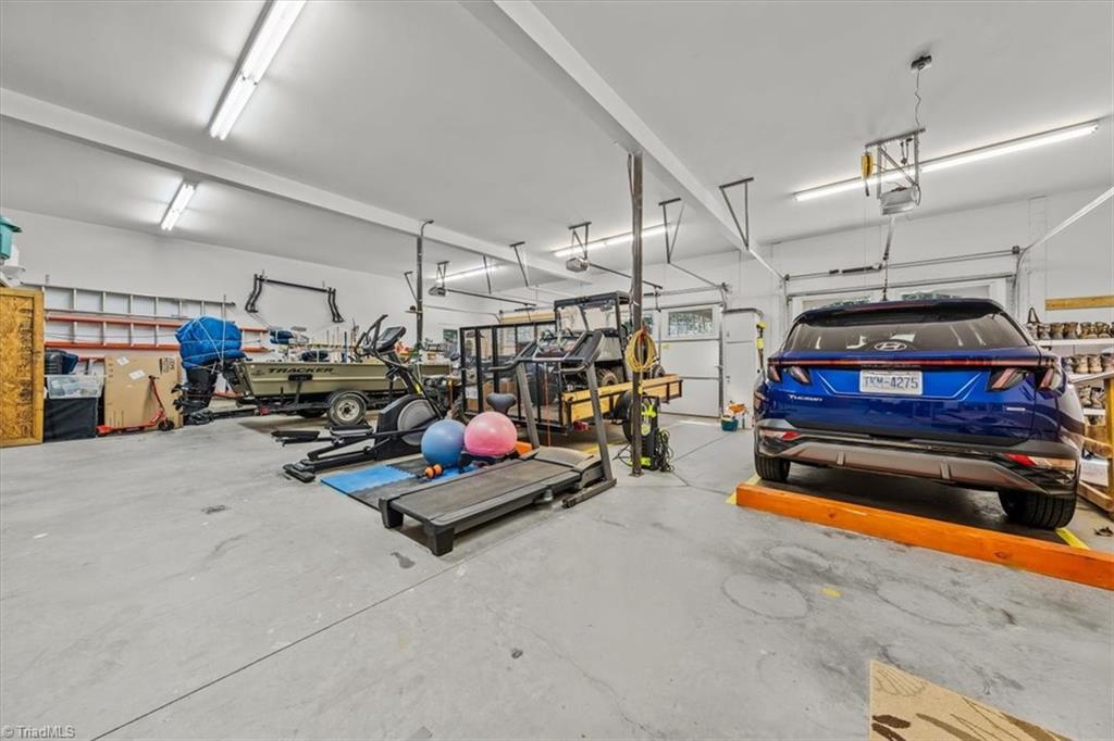 2207 Sierra Trace Road Denton, NC 27239 - Photo 38 of 49 Expansive Oversized 3 car garage offering incredible space for vehicles, boats, hobbies, and storage