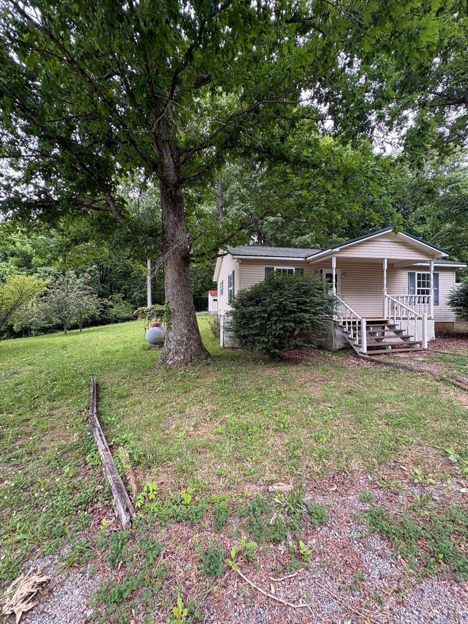 2174 Pleasant Hill Road Lynchburg, TN 37352 - Photo 2 of 16 a view of a house with backyard and sitting area