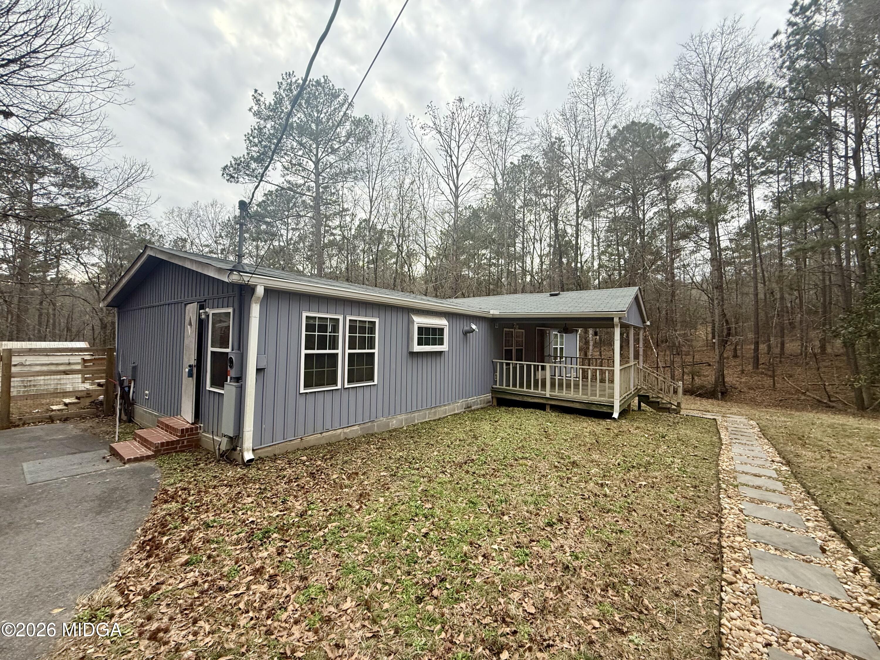 307 Old Dames Ferry Road Juliette, GA 31046 - Photo 13 of 13 a view of a house with a yard