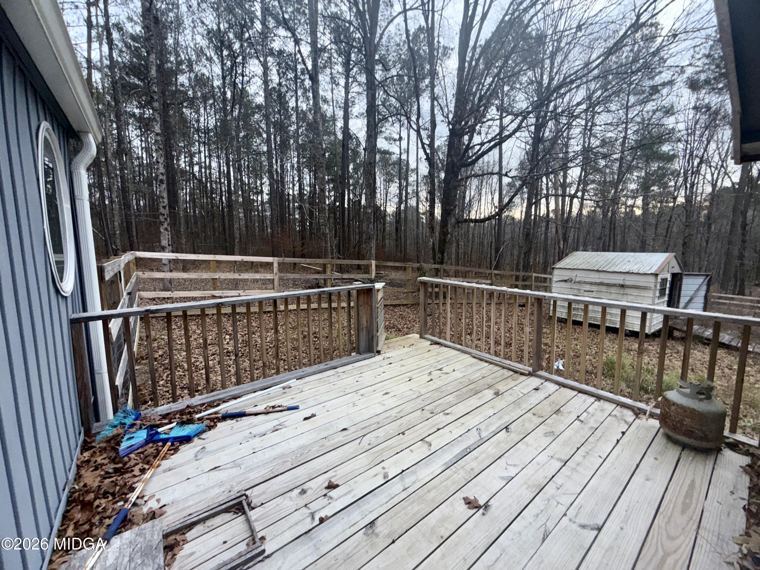 307 Old Dames Ferry Road Juliette, GA 31046 - Photo 7 of 13 a view of deck with wooden floor and outdoor seating