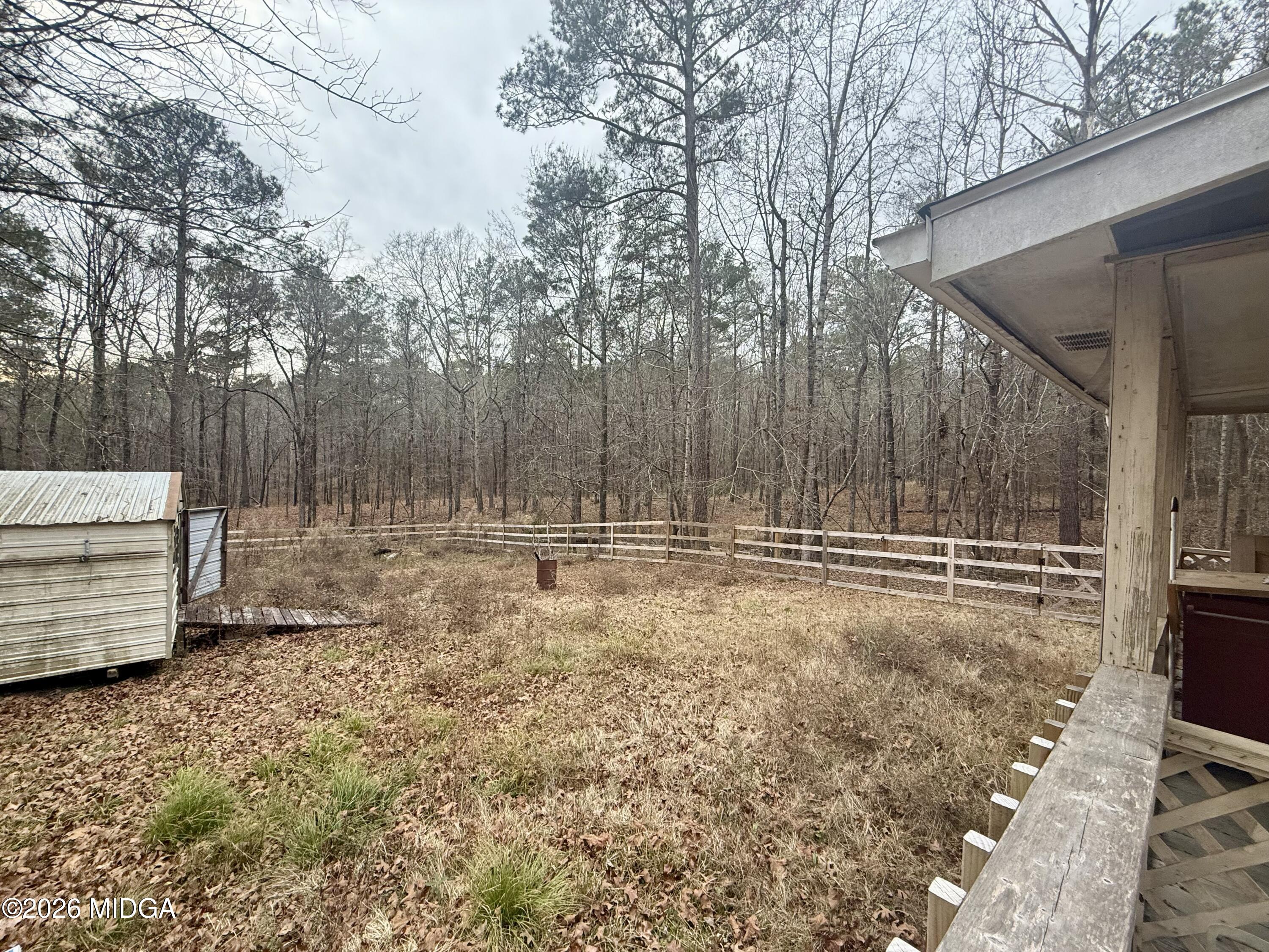 307 Old Dames Ferry Road Juliette, GA 31046 - Photo 9 of 13 a view of backyard and tree