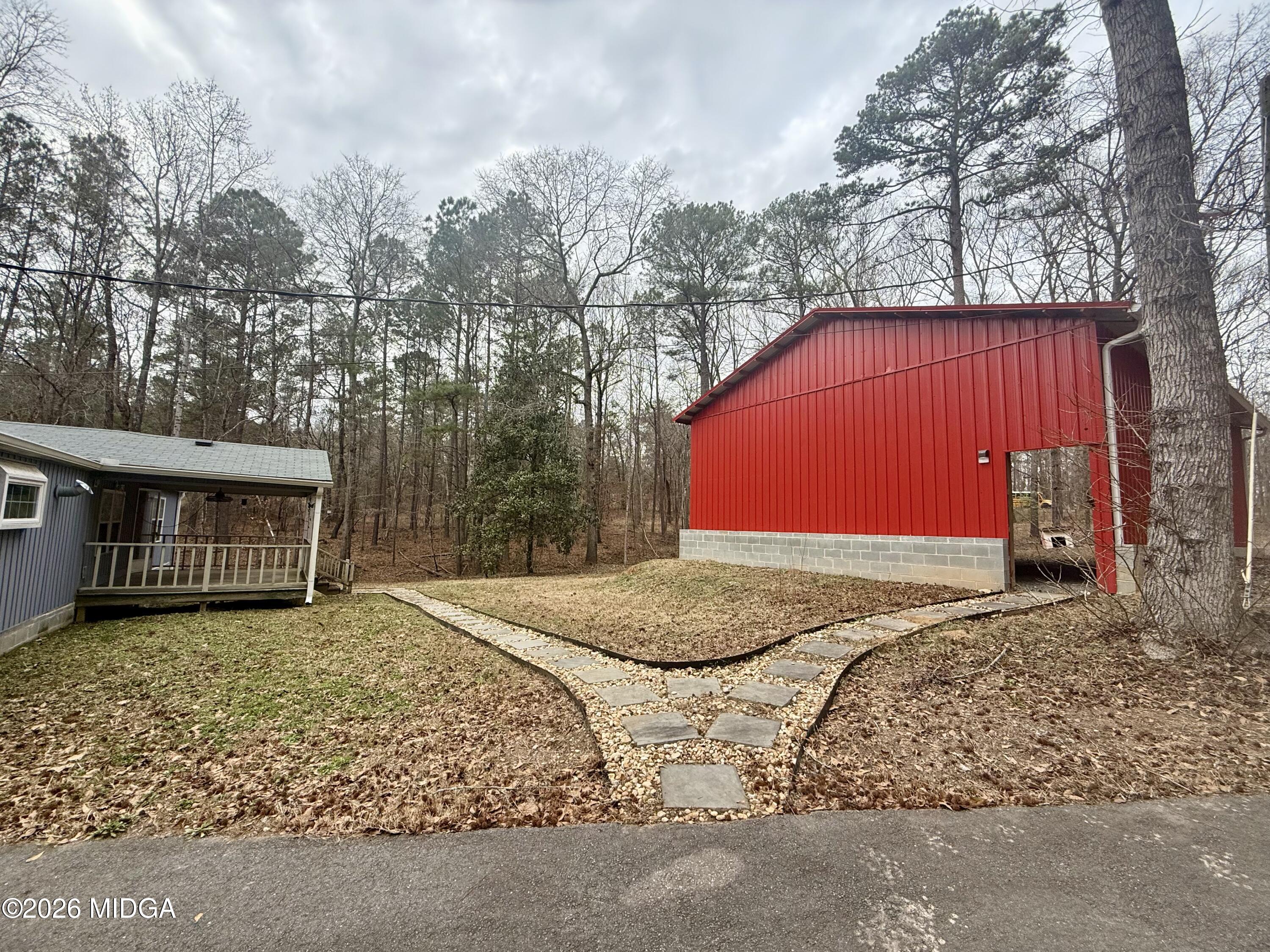 307 Old Dames Ferry Road Juliette, GA 31046 - Photo 10 of 13 a view of a backyard with a barn