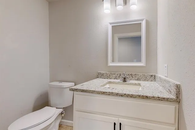 a kitchen with cabinets appliances and a counter space