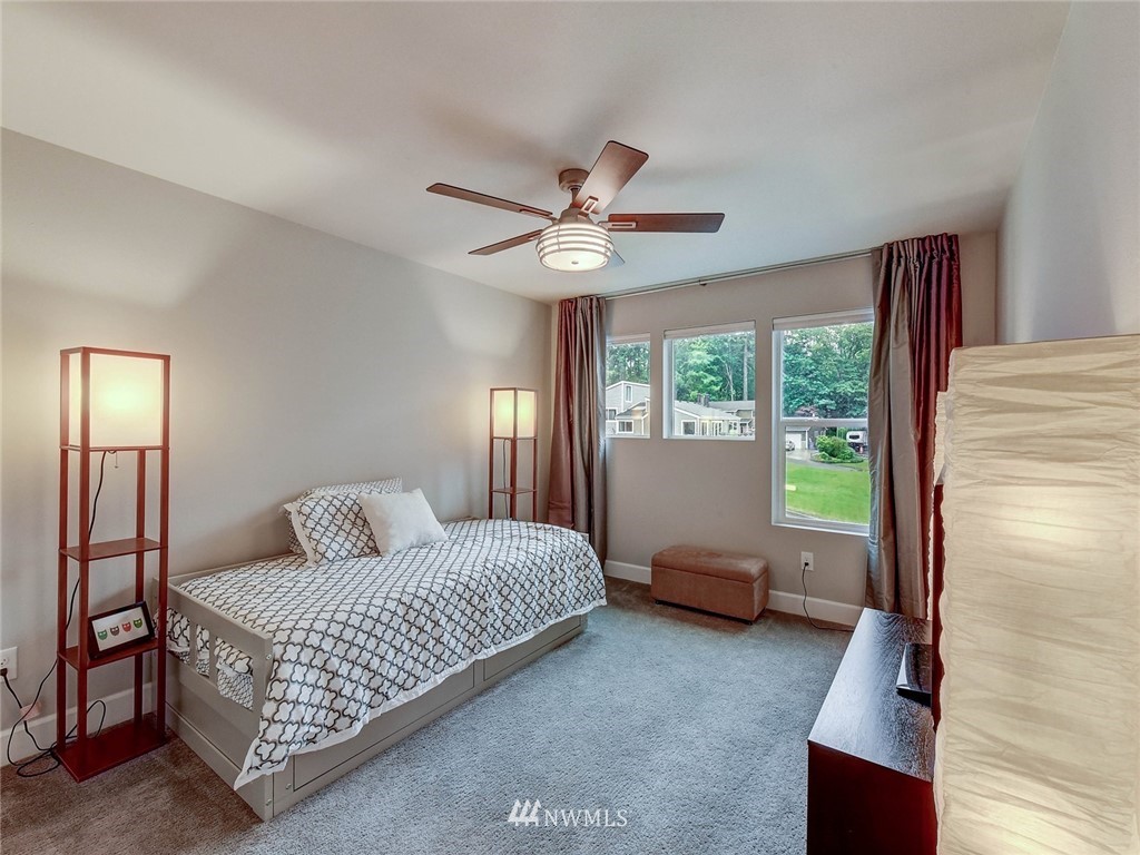 318 181st Street Southeast Bothell, WA 98012 - Photo 14 of 24 a living room with a bed furniture and a window