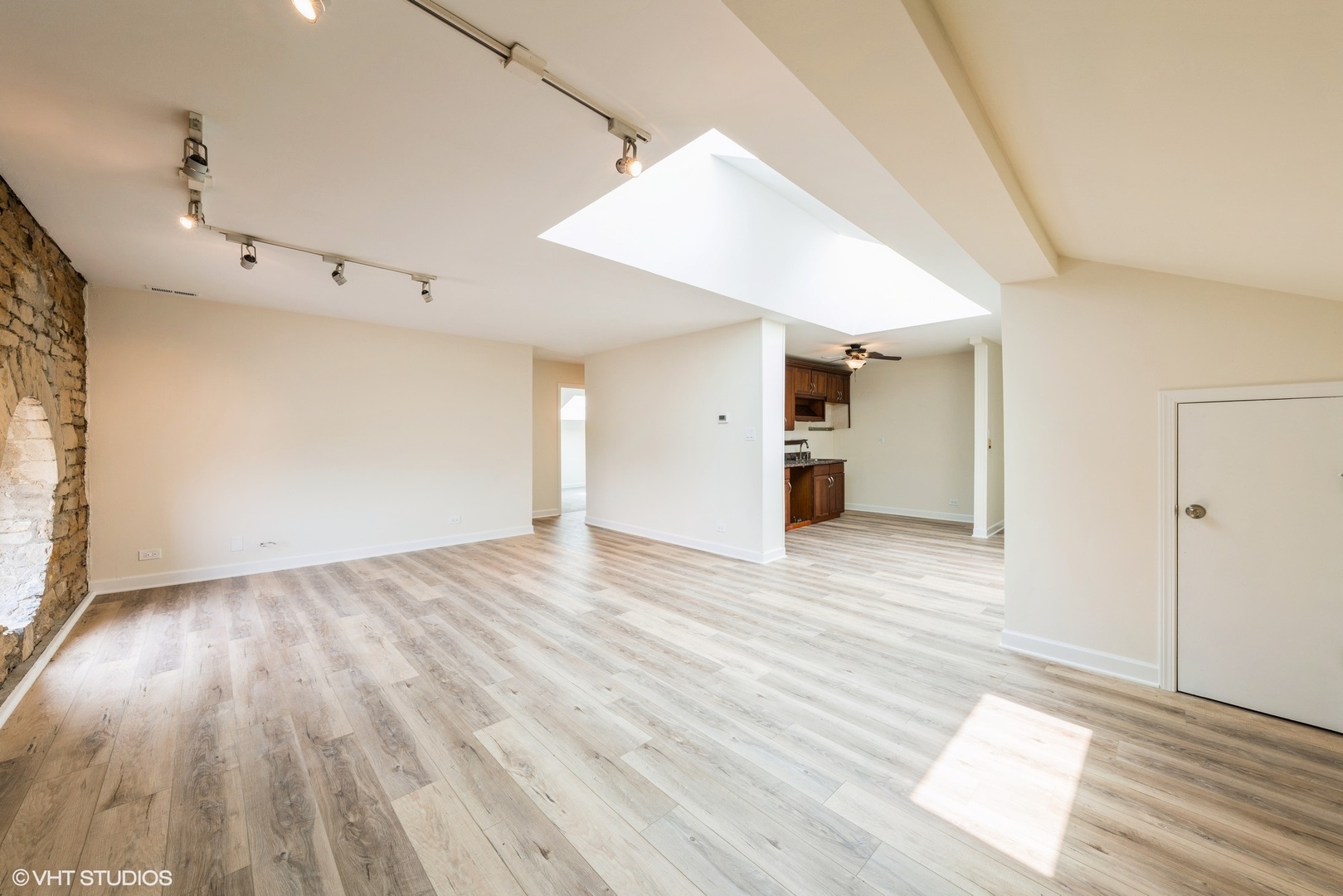 400 McCarthy Road, Unit 421 Lemont, IL 60439 - Photo 3 of 8 a view of an empty room with wooden floor and a window