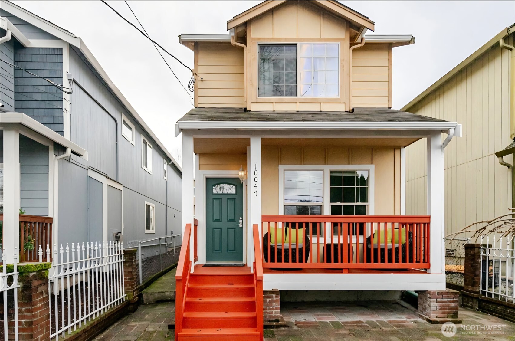 10047 17th Avenue Southwest Seattle, WA 98146 - Photo 1 of 27 a view of a house with wooden fence