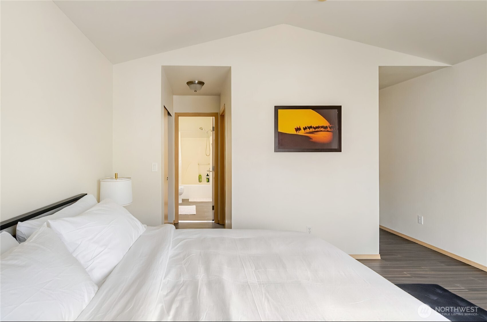 10047 17th Avenue Southwest Seattle, WA 98146 - Photo 11 of 27 a view of a bedroom with bed and wall painting