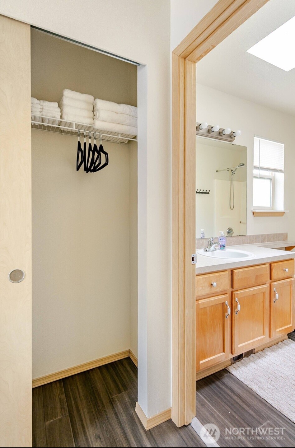 10047 17th Avenue Southwest Seattle, WA 98146 - Photo 14 of 27 a bathroom with a sink and a mirror
