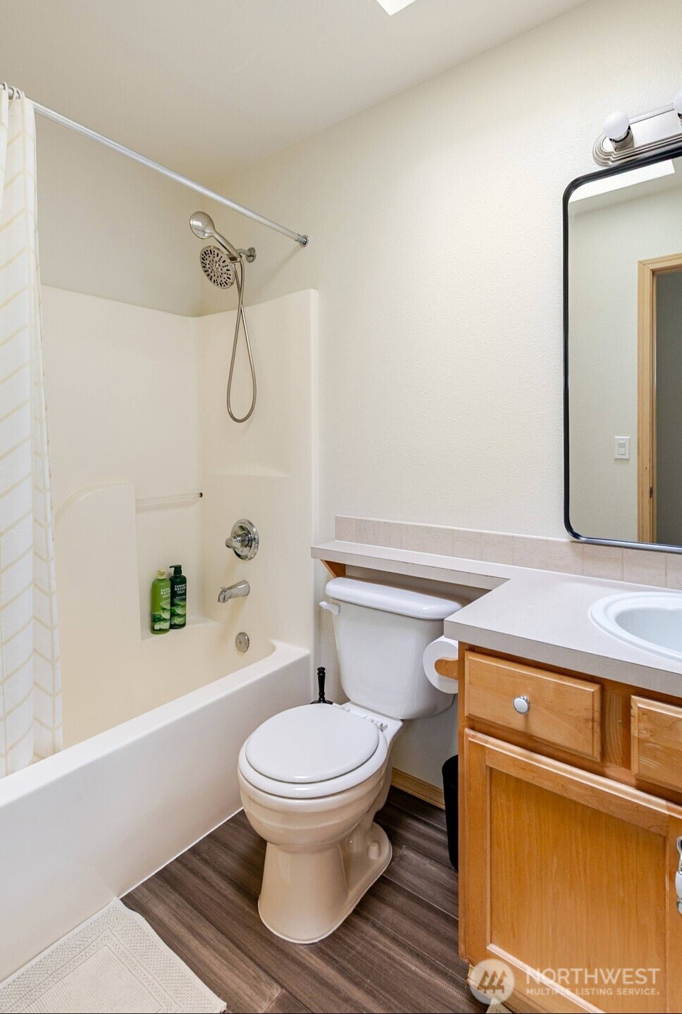10047 17th Avenue Southwest Seattle, WA 98146 - Photo 21 of 27 a bathroom with a toilet and a shower