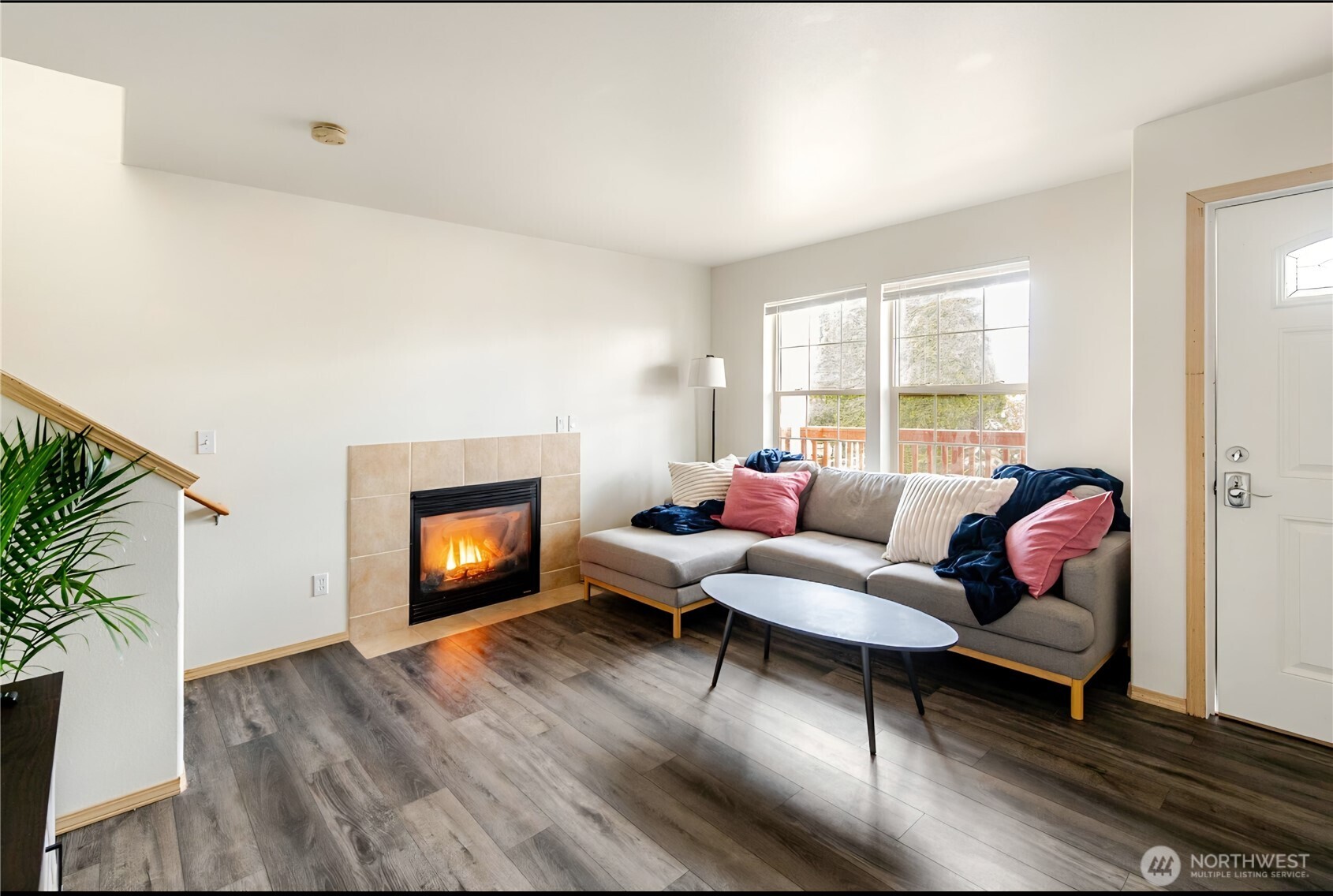 10047 17th Avenue Southwest Seattle, WA 98146 - Photo 3 of 27 a living room with furniture and a fireplace