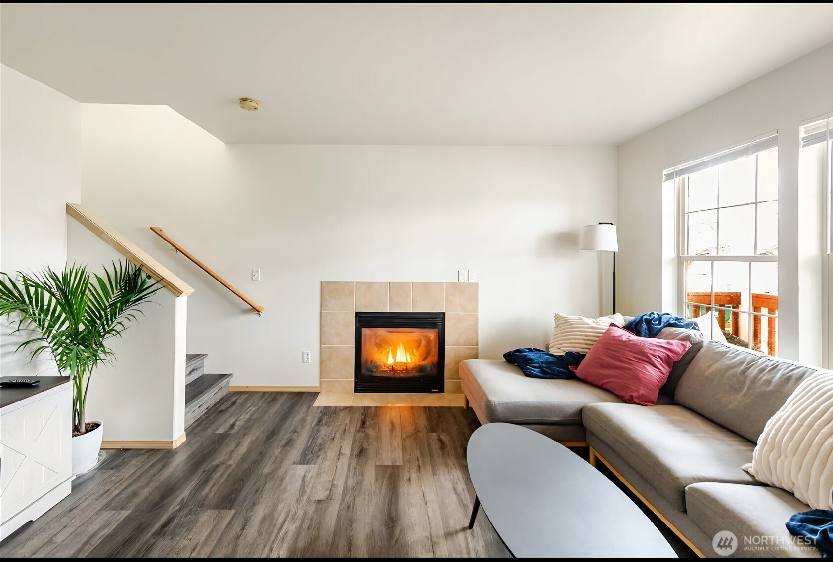 10047 17th Avenue Southwest Seattle, WA 98146 - Photo 4 of 27 a living room with furniture and a wooden floor