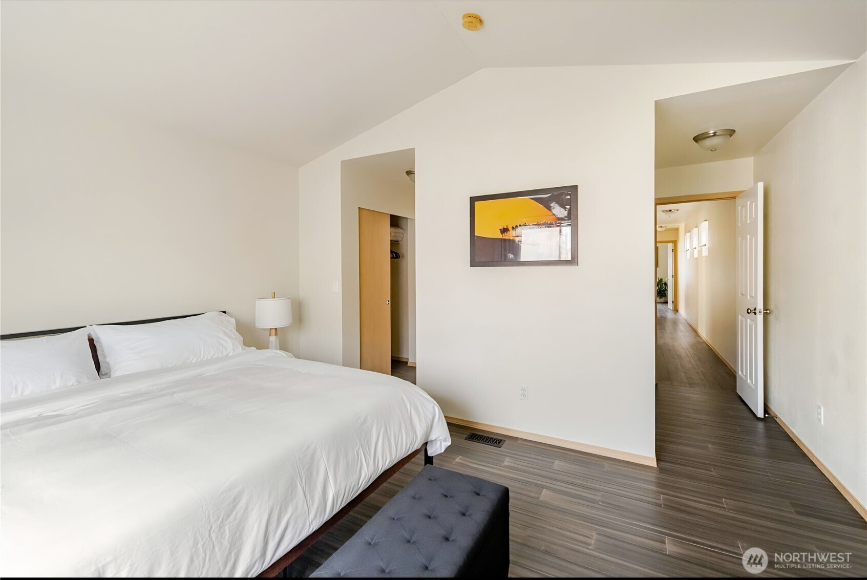 10047 17th Avenue Southwest Seattle, WA 98146 - Photo 10 of 27 a bedroom with a bed and a painting on the wall