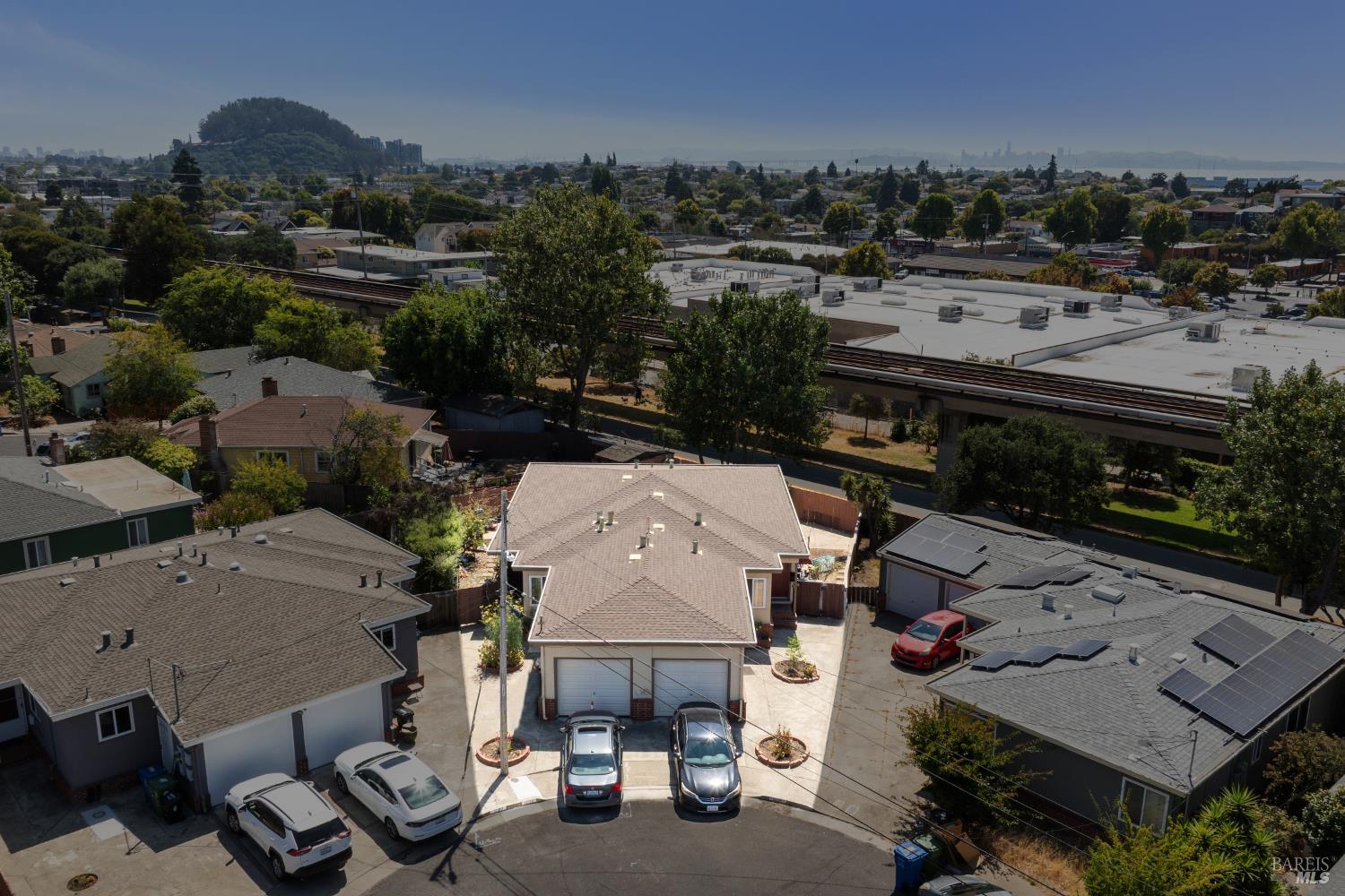 1029 Ranchito Court El Cerrito, CA 94530 - Photo 4 of 6 an aerial view of a house with a garden and mountain view in back