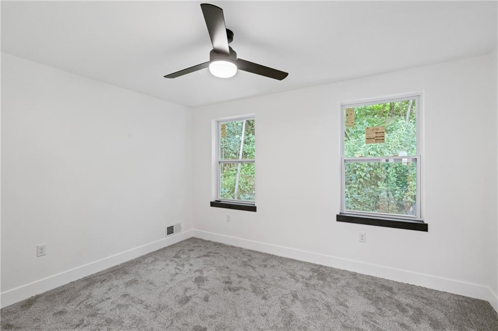 1102 Spring Garden Avenue Pittsburgh, PA 15212 - Photo 20 of 25 a view of a big room with windows and chandelier fan