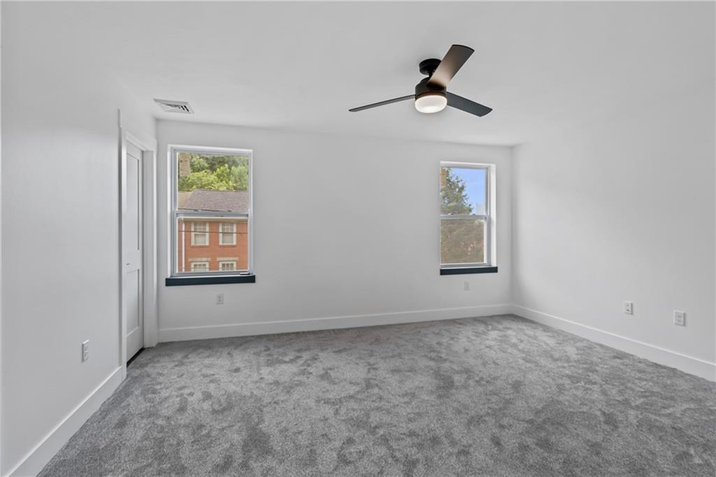 1102 Spring Garden Avenue Pittsburgh, PA 15212 - Photo 22 of 25 an empty room with windows