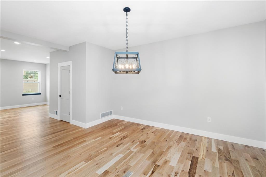 1102 Spring Garden Avenue Pittsburgh, PA 15212 - Photo 7 of 25 a view of a room with wooden floor and white walls