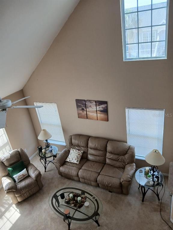 5581 Rosehill Road, Unit 203 Sarasota, FL 34233 - Photo 7 of 17 a living room with furniture and a couch
