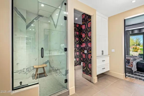 a bedroom with a bed and a couch