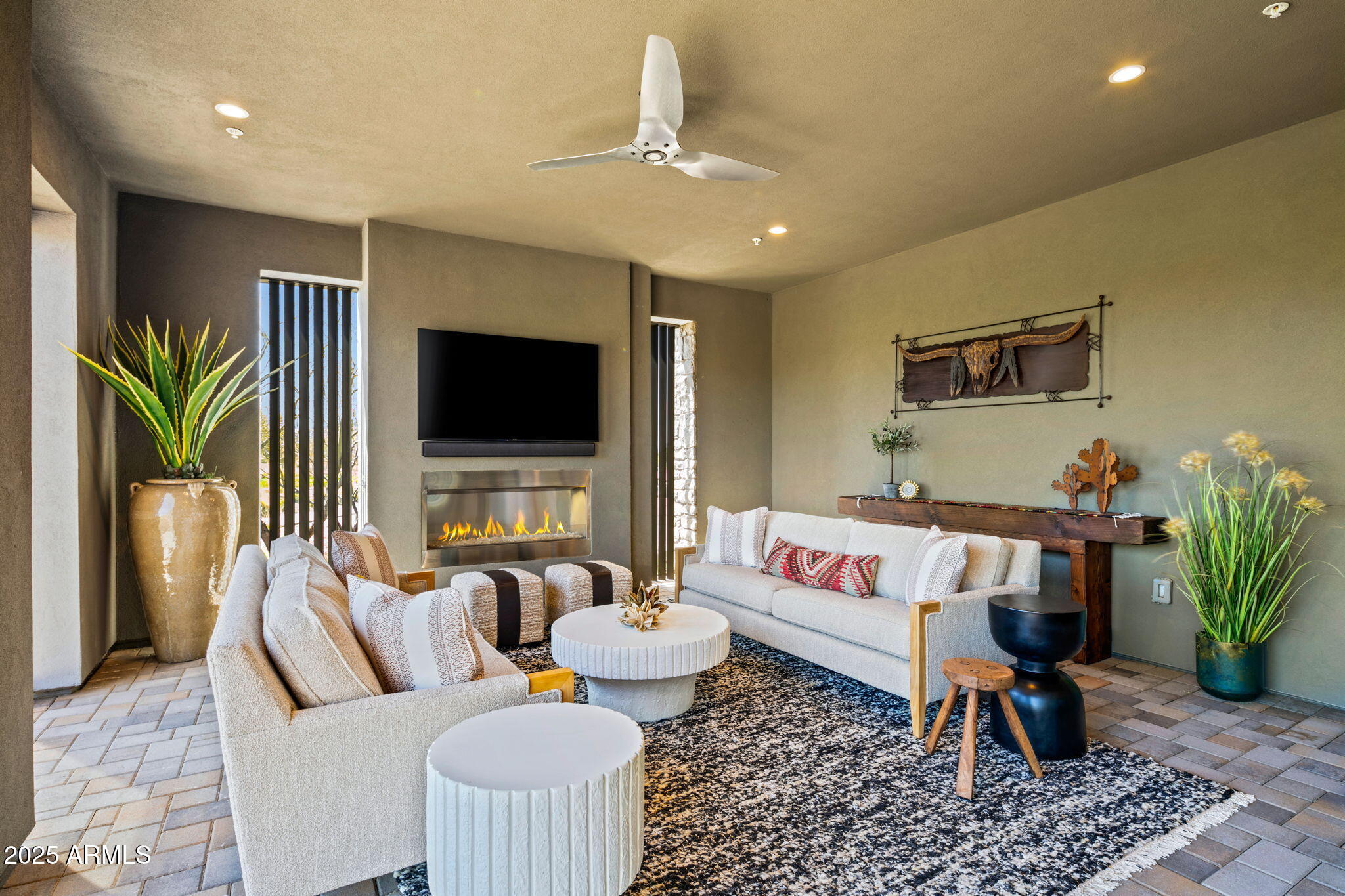 37200 North Cave Creek Road, Unit 1126 Scottsdale, AZ 85262 - Photo 24 of 28 a living room with furniture and a flat screen tv
