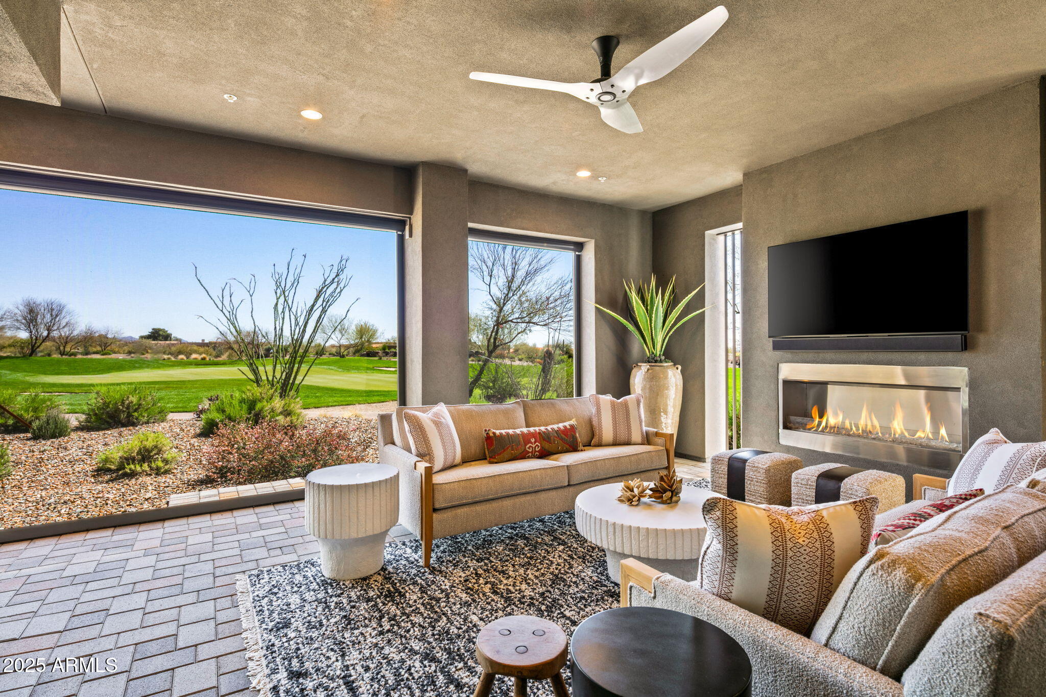 37200 North Cave Creek Road, Unit 1126 Scottsdale, AZ 85262 - Photo 25 of 28 a living room with furniture and a flat screen tv