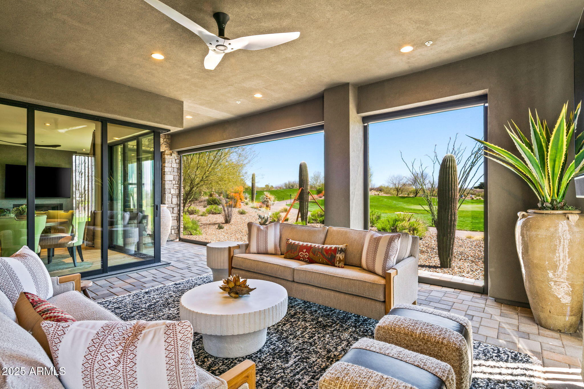 37200 North Cave Creek Road, Unit 1126 Scottsdale, AZ 85262 - Photo 26 of 28 a living room with furniture and a large window