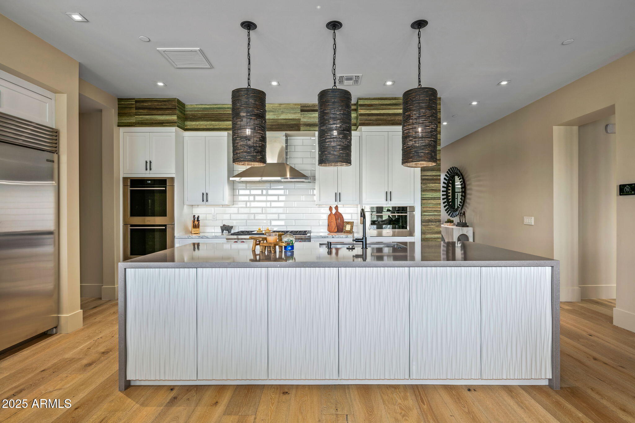 37200 North Cave Creek Road, Unit 1126 Scottsdale, AZ 85262 - Photo 10 of 28 a kitchen with stainless steel appliances kitchen island granite countertop a refrigerator a oven and a wooden floors