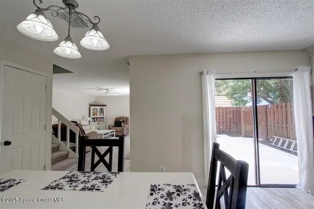 a view of a livingroom with furniture window and wooden floor