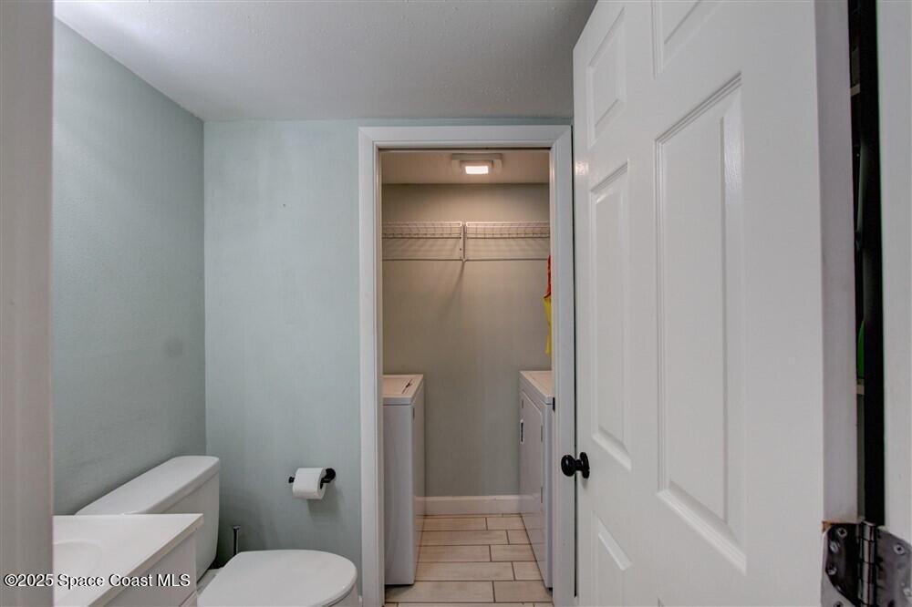 1717 Patty Circle Northeast Palm Bay, FL 32905 - Photo 16 of 35 a bathroom with a toilet and a shower