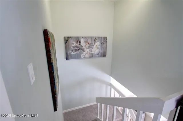 a view of a hallway with staircase