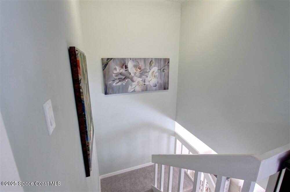 1717 Patty Circle Northeast Palm Bay, FL 32905 - Photo 19 of 35 a view of a hallway with staircase