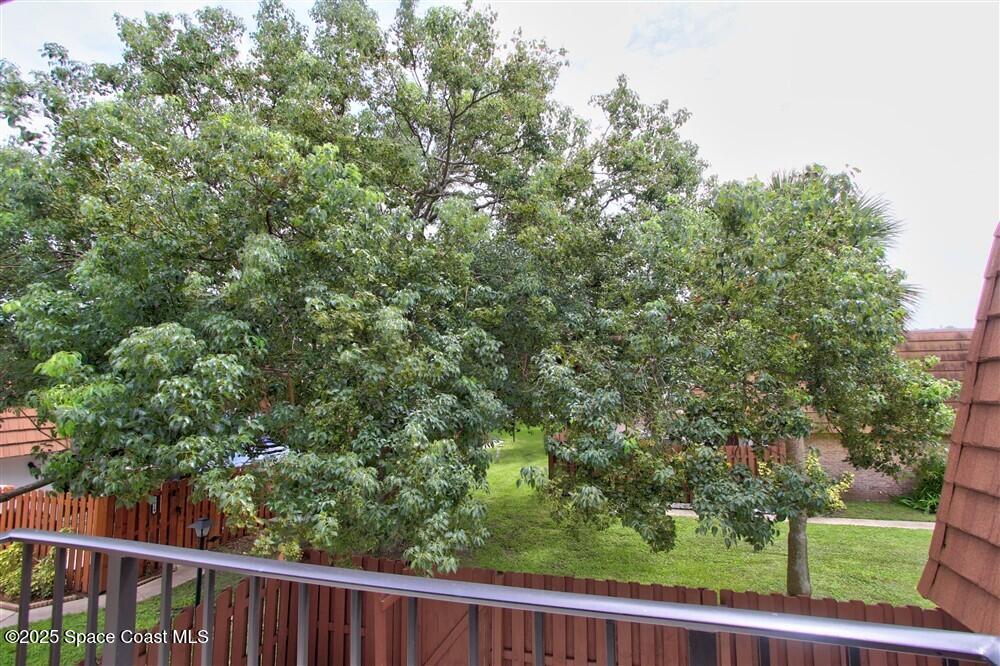 1717 Patty Circle Northeast Palm Bay, FL 32905 - Photo 22 of 35 a view of a yard from a balcony