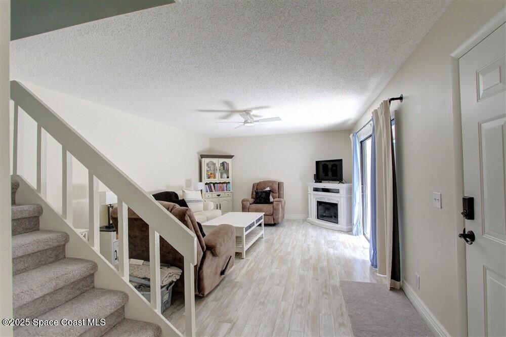 1717 Patty Circle Northeast Palm Bay, FL 32905 - Photo 3 of 35 a living room with furniture and flat screen tv