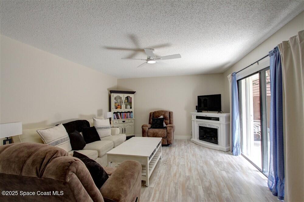 1717 Patty Circle Northeast Palm Bay, FL 32905 - Photo 6 of 35 a bedroom with a bed and a flat screen tv