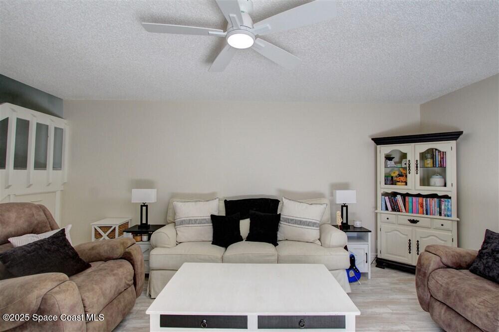 1717 Patty Circle Northeast Palm Bay, FL 32905 - Photo 7 of 35 a bedroom with a bed furniture and a couch