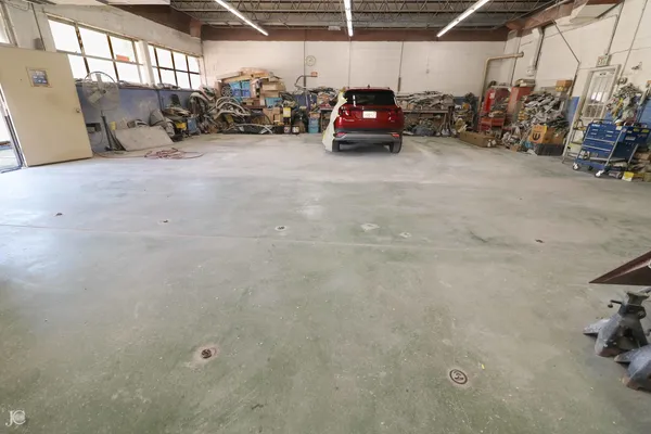 a view of parking garage with cars