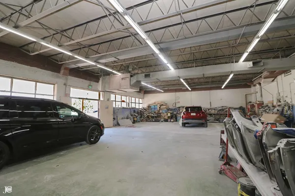 a view of parking garage with cars