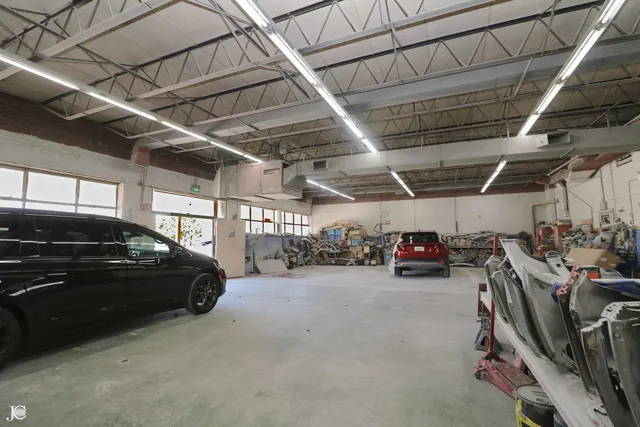 a view of parking garage with cars