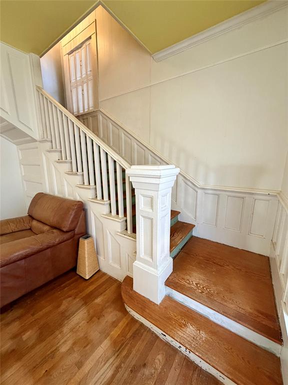 600 Mercer Street Quanah, TX 79252 - Photo 4 of 28 a view of staircase with white walls and a rug