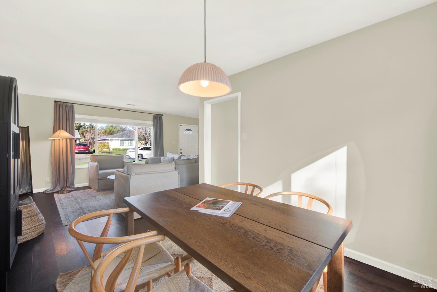 1837 Vermont Street Fairfield, CA 94533 - Photo 21 of 56 a living room with dining table and a chandelier
