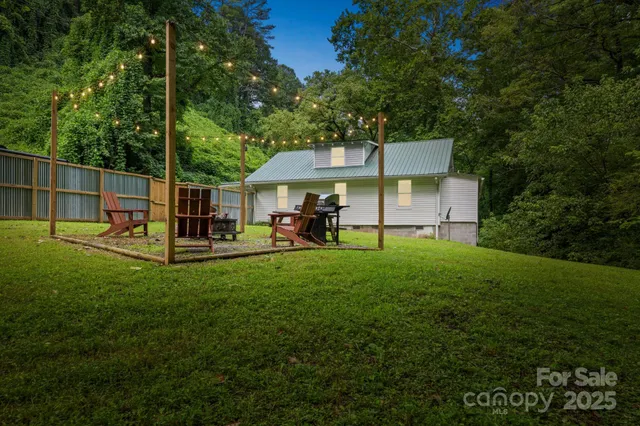 a view of a chair and table in the garden