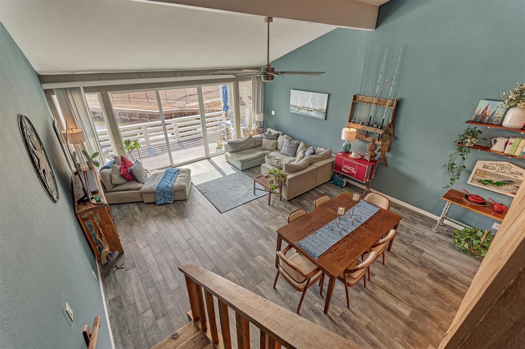 1 April Point Drive South Montgomery, TX 77356 - Photo 17 of 45 A view from the top of the stairs overlooks the main living area, where durable tile flooring spans the entire first floor for style and easy maintenance.