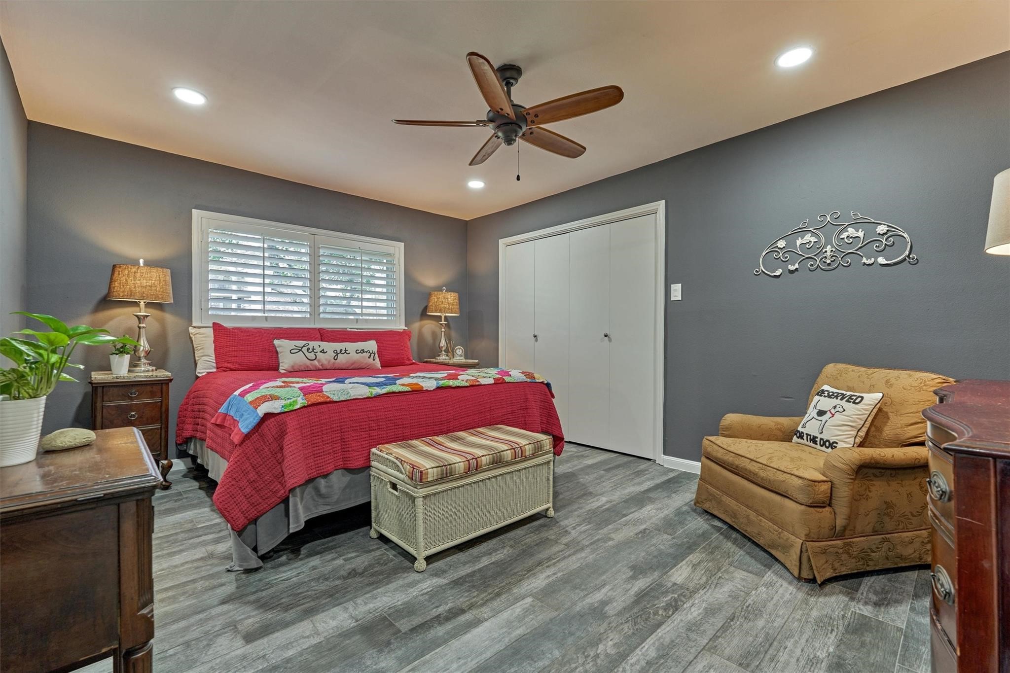 1 April Point Drive South Montgomery, TX 77356 - Photo 21 of 45 The first floor bedroom features custom shutters, a large walk-in closet and an ensuite bath.