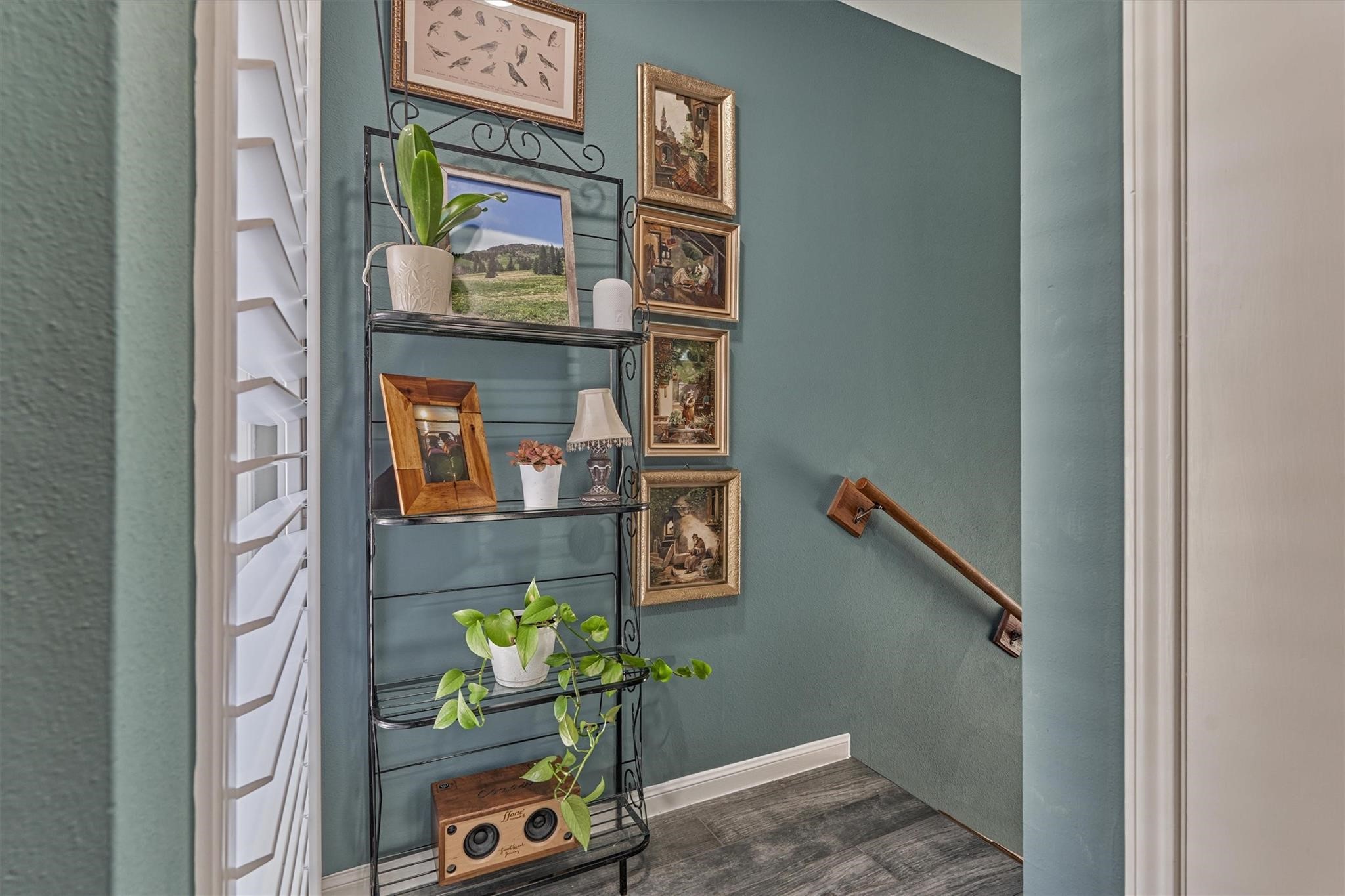 1 April Point Drive South Montgomery, TX 77356 - Photo 24 of 45 The landing at the second floor has a window with a custom shutter for letting in natural light.