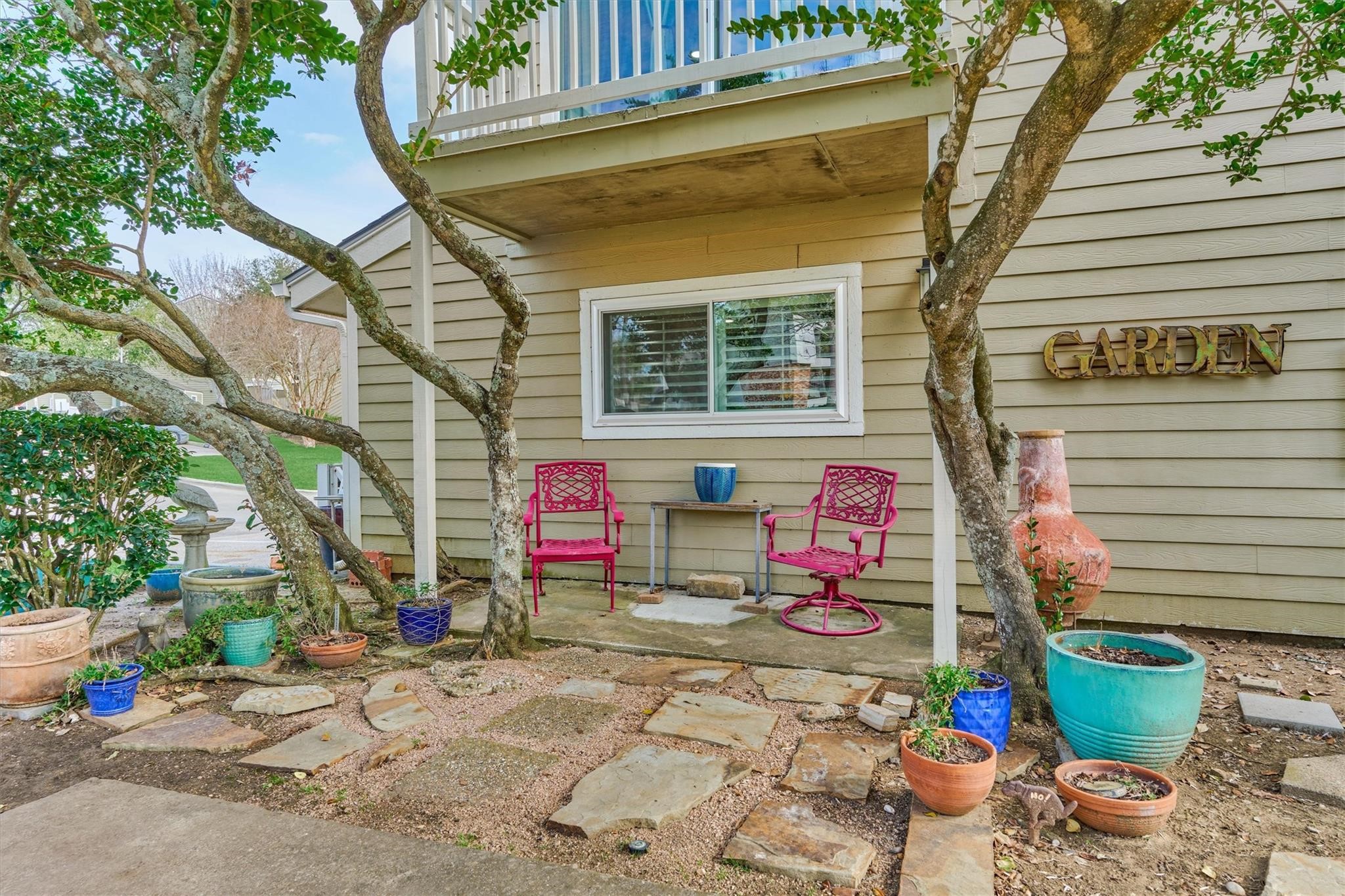 1 April Point Drive South Montgomery, TX 77356 - Photo 32 of 45 33. This side courtyard is only available on this end unit. The balcony above was newly constructed in 2024.