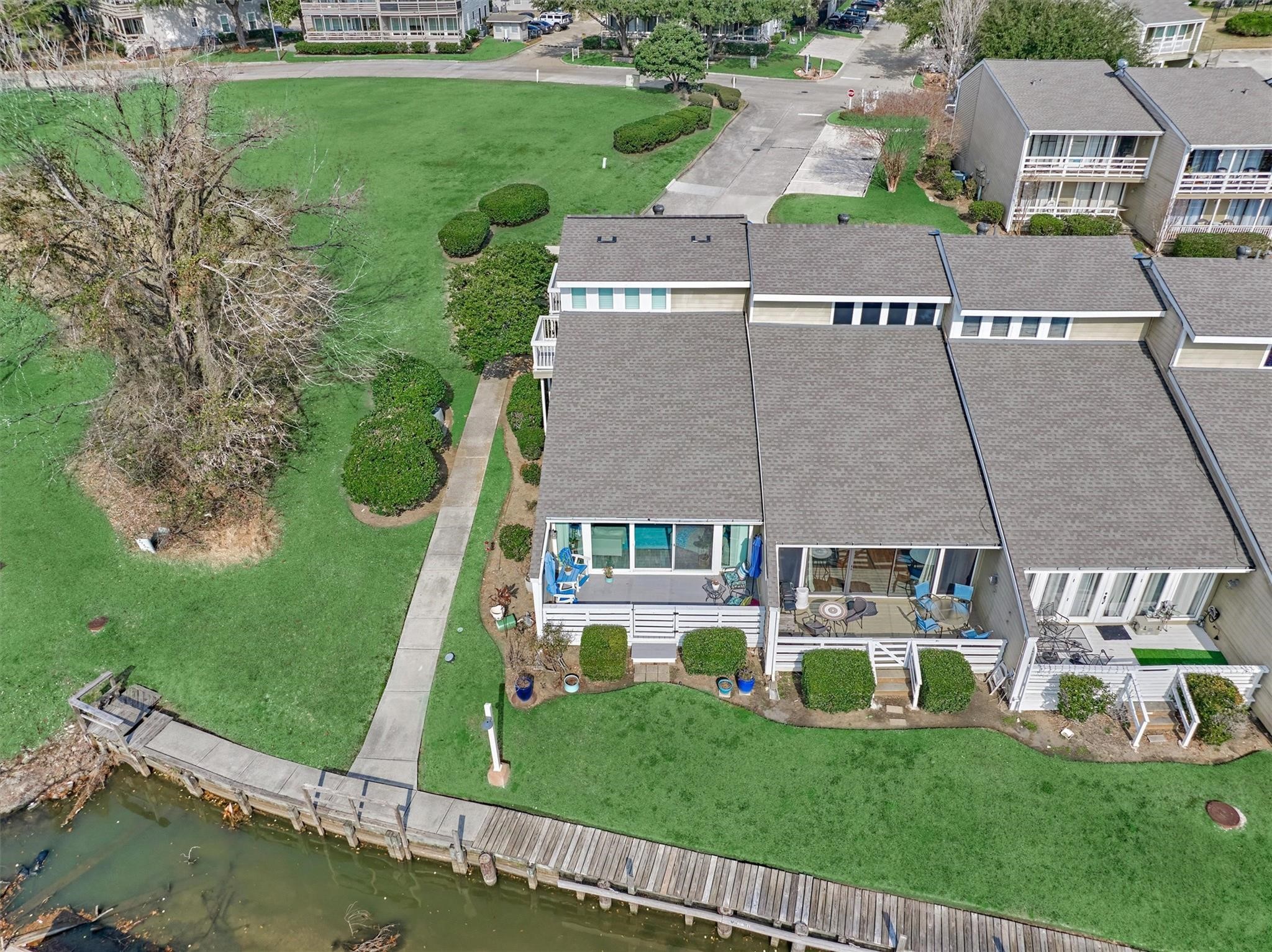 1 April Point Drive South Montgomery, TX 77356 - Photo 33 of 45 34. An overhead view shows the drive in to the townhome, sidewalk and back porch.