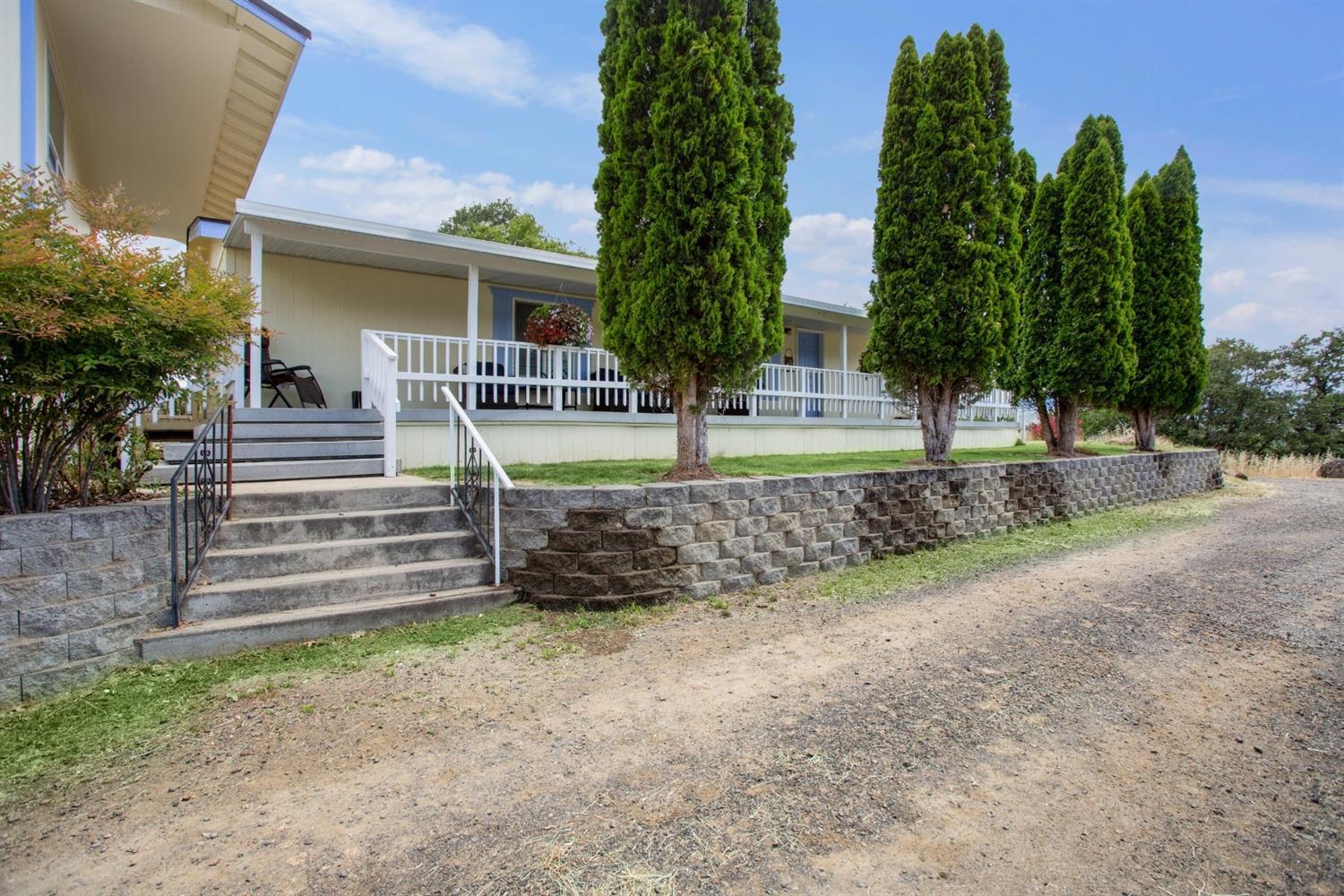 940 Ayres Road Eagle Point, OR 97524 - Photo 1 of 35 a view of a house with a yard and plants