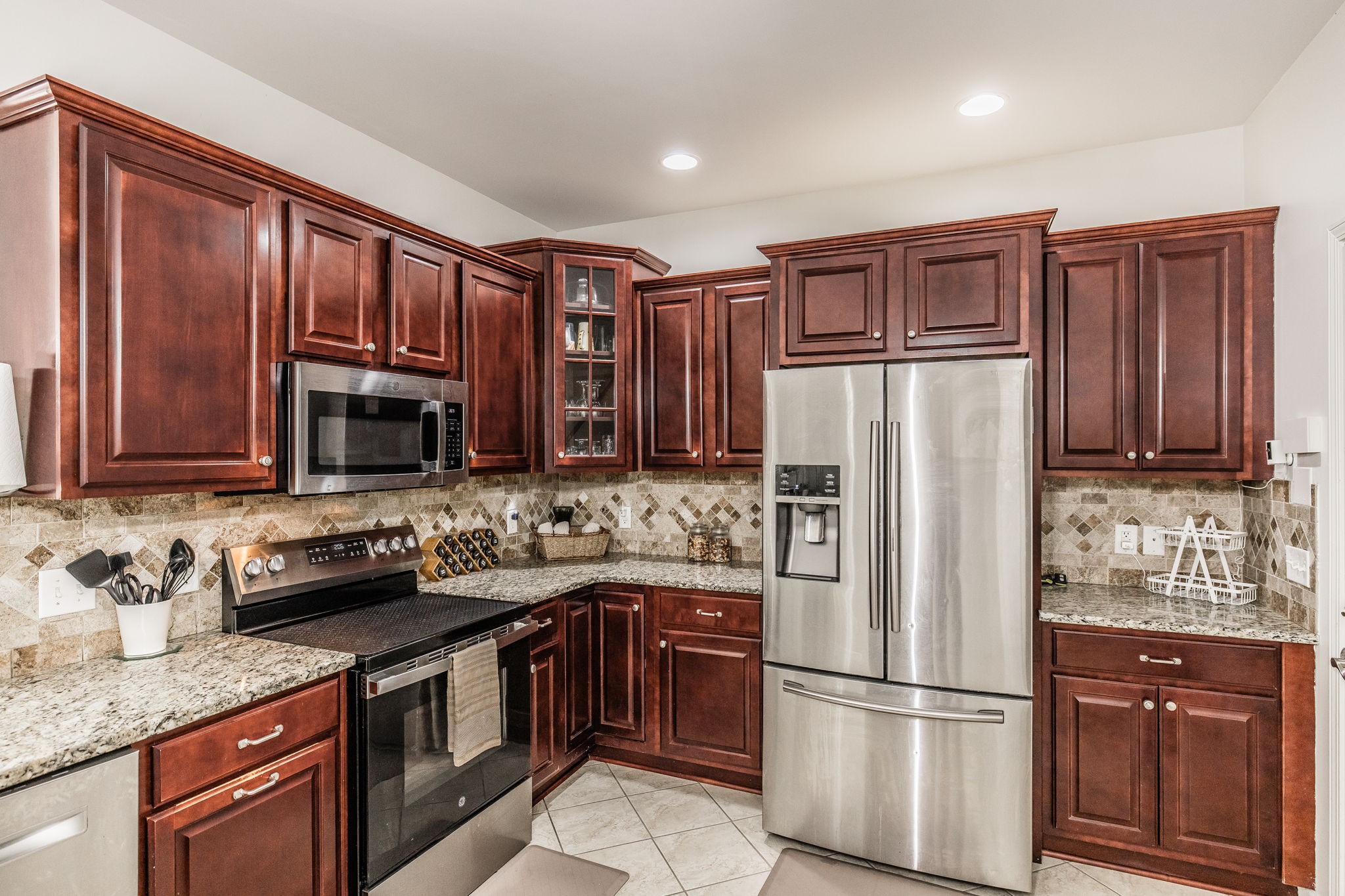2860 Morgan Road Joelton, TN 37080 - Photo 13 of 45 a kitchen with stainless steel appliances granite countertop a refrigerator stove and sink